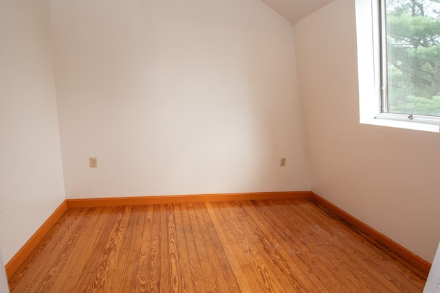 unfurnished room with light wood-type flooring