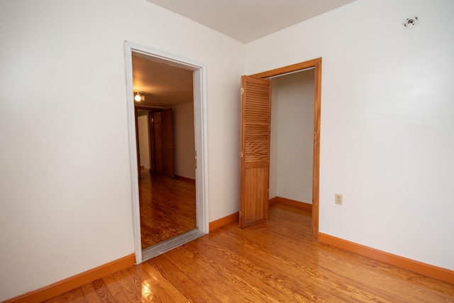 unfurnished room featuring light hardwood / wood-style flooring