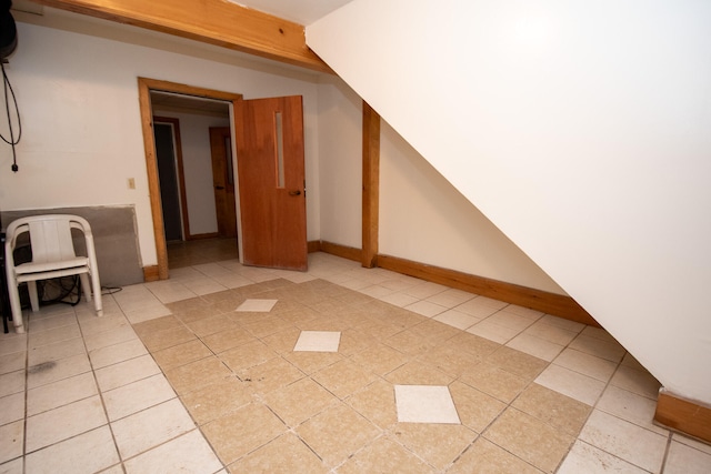 bonus room featuring light tile patterned floors