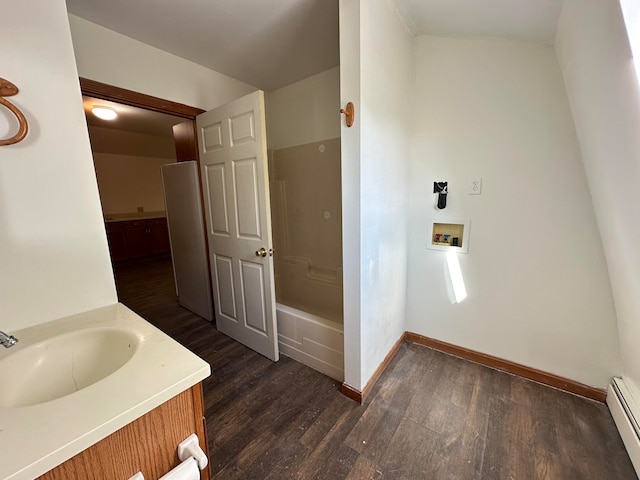 bathroom featuring hardwood / wood-style floors, vanity, and a baseboard radiator