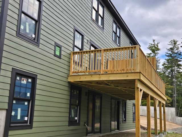 view of home's exterior with a wooden deck