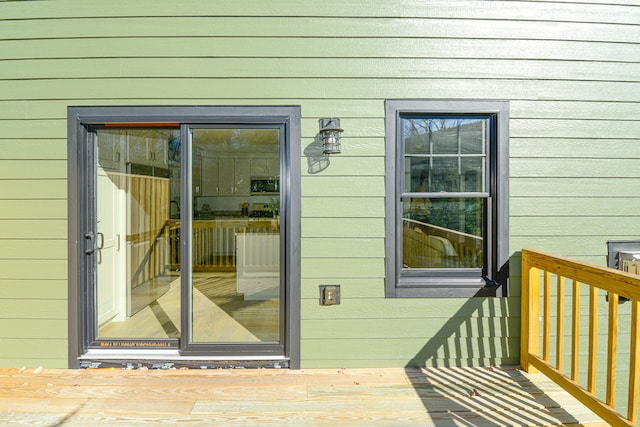 property entrance with a wooden deck