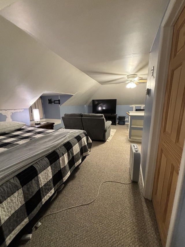 bedroom featuring carpet, lofted ceiling, and ceiling fan