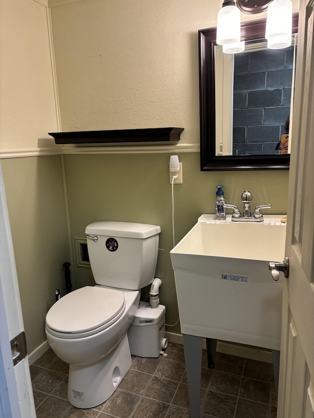 bathroom featuring tile patterned flooring and toilet