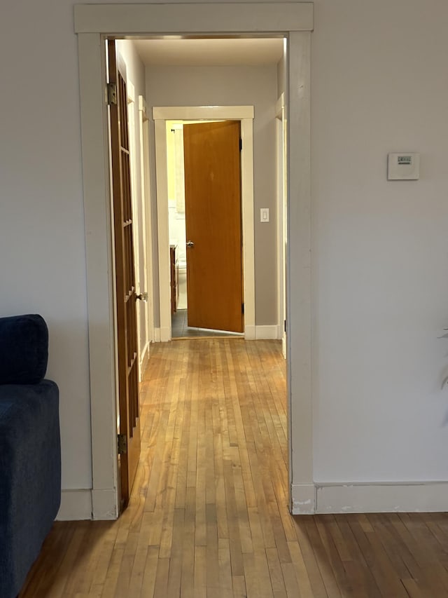 corridor featuring light hardwood / wood-style floors