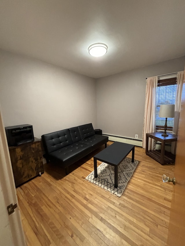 living room featuring light hardwood / wood-style floors and baseboard heating