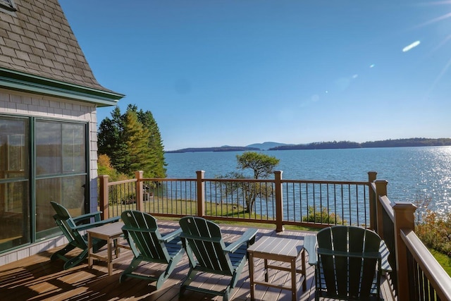 deck featuring a water view