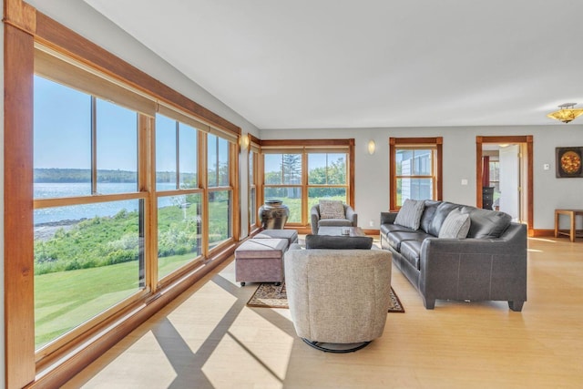 65 Grange Hall Rd, Sullivan, ME 04664 - living area featuring a water view, baseboards, and light wood-type flooring
