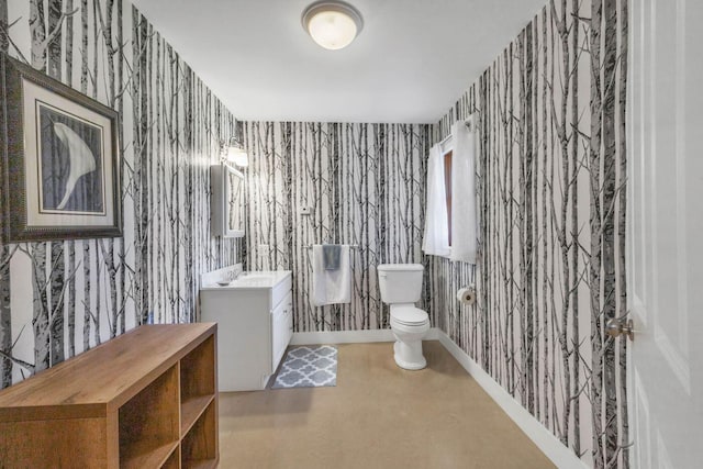 65 Grange Hall Rd, Sullivan, ME 04664 - bathroom featuring toilet, vanity, and wallpapered walls