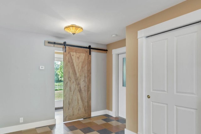 foyer entrance with a barn door