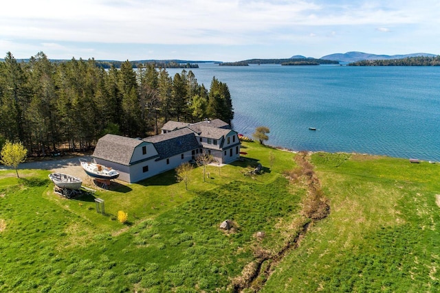 bird's eye view with a water and mountain view