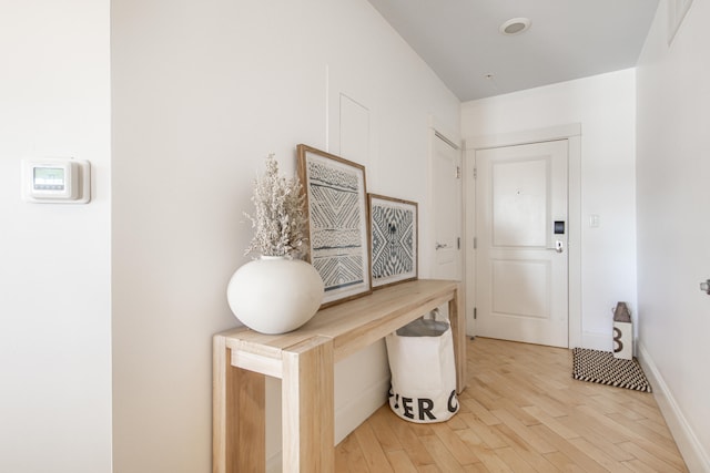 doorway with light hardwood / wood-style floors