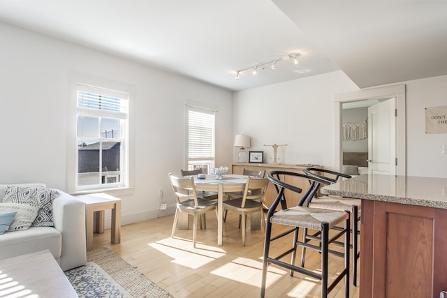 dining area with light hardwood / wood-style floors