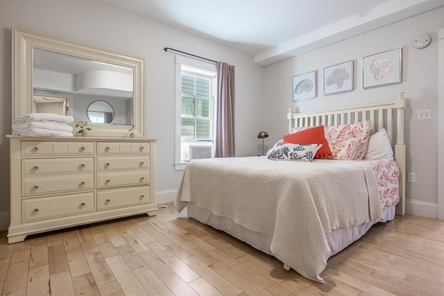 bedroom featuring cooling unit and light wood-type flooring