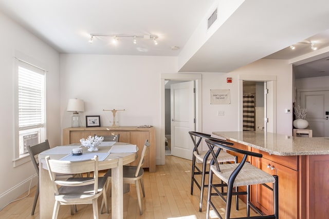 dining room with light hardwood / wood-style floors