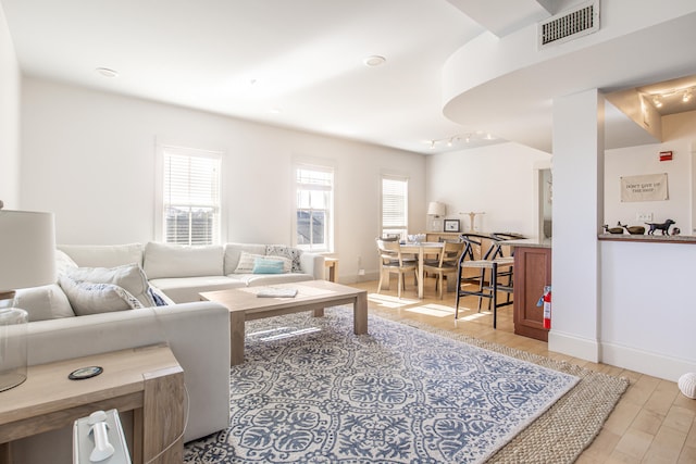 living room with light hardwood / wood-style floors