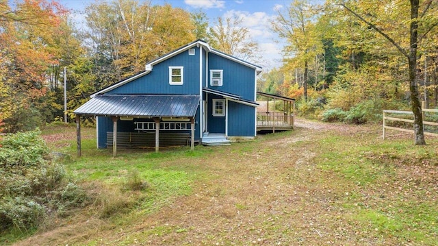 back of house with a wooden deck