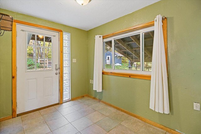 entryway featuring a textured ceiling