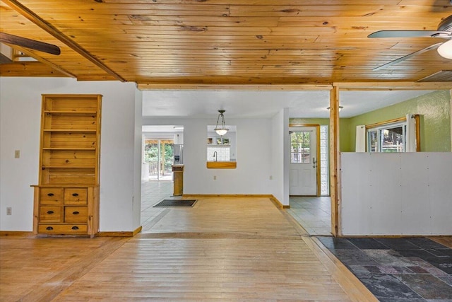 entryway featuring plenty of natural light, wooden ceiling, and wood-type flooring