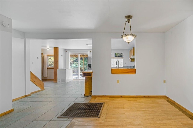 spare room featuring light wood-type flooring