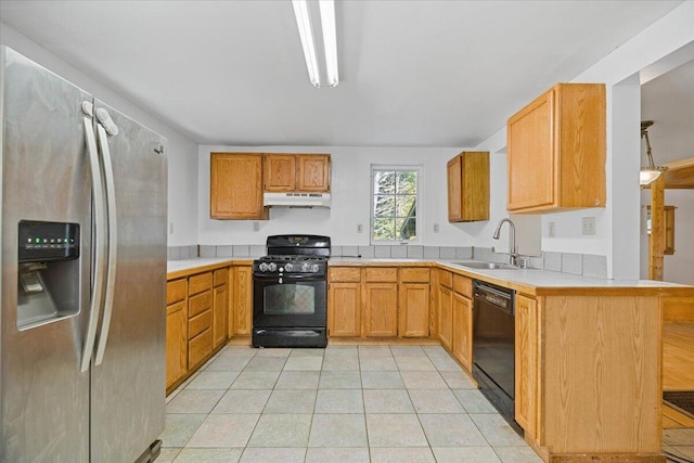 kitchen with kitchen peninsula, black appliances, sink, and light tile patterned floors