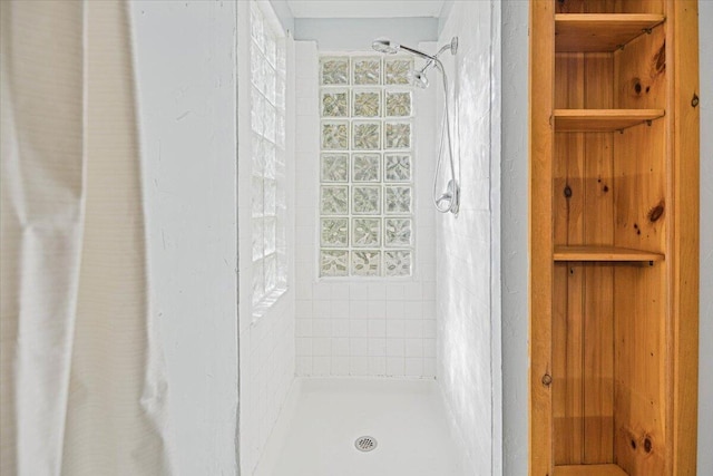 bathroom featuring a shower with curtain