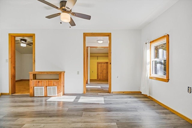 unfurnished bedroom featuring ceiling fan and light hardwood / wood-style flooring