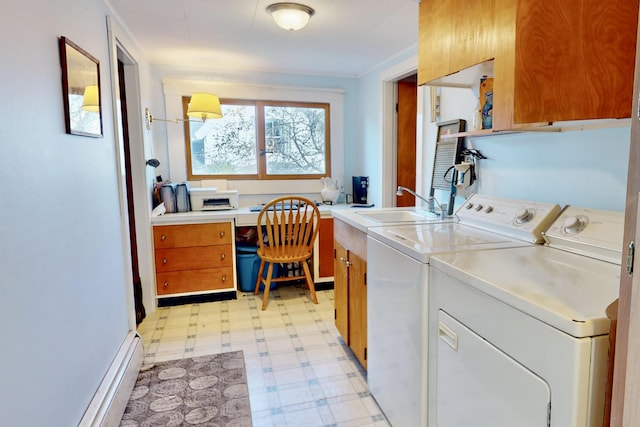 laundry room featuring separate washer and dryer, a sink, cabinet space, and light floors