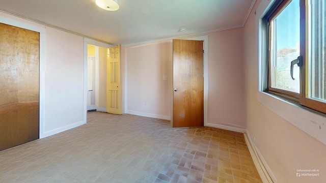 unfurnished bedroom with crown molding