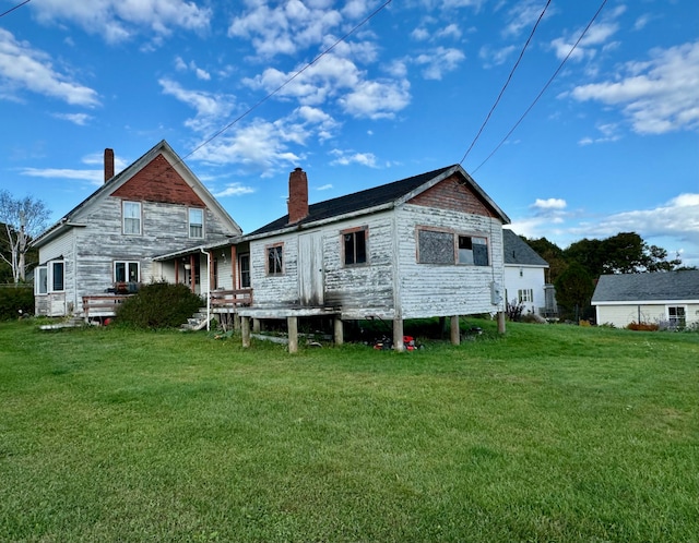 back of property with a yard