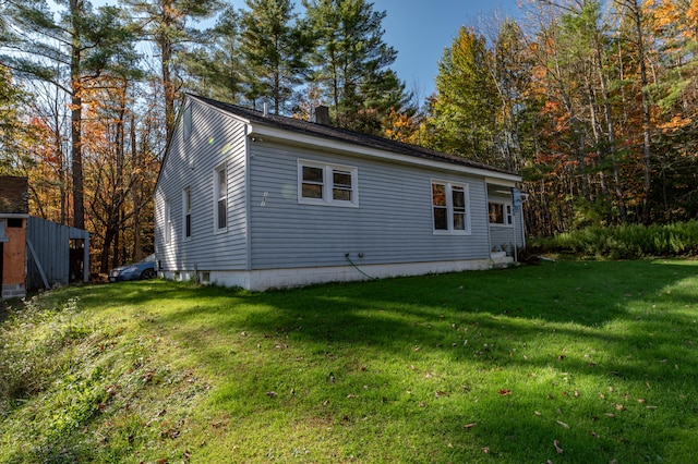 view of home's exterior with a lawn