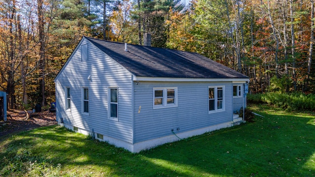 view of property exterior featuring a lawn