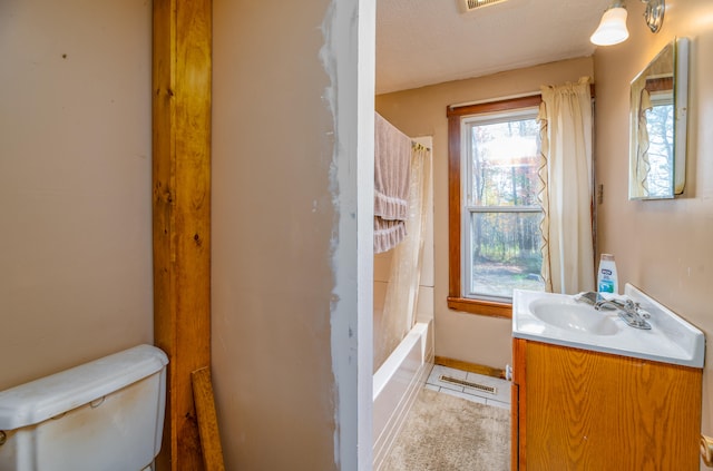 full bathroom with tile patterned flooring, toilet, shower / bath combo, vanity, and a textured ceiling