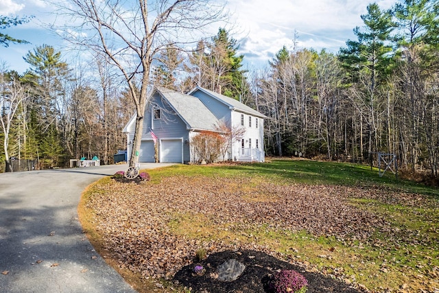49 Balsam Dr, Waldoboro, ME 04572 - view of side of home with a garage and a yard