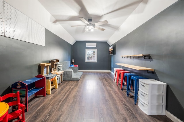 49 Balsam Dr, Waldoboro, ME 04572 - recreation room featuring lofted ceiling, an AC wall unit, ceiling fan, and dark wood-type flooring