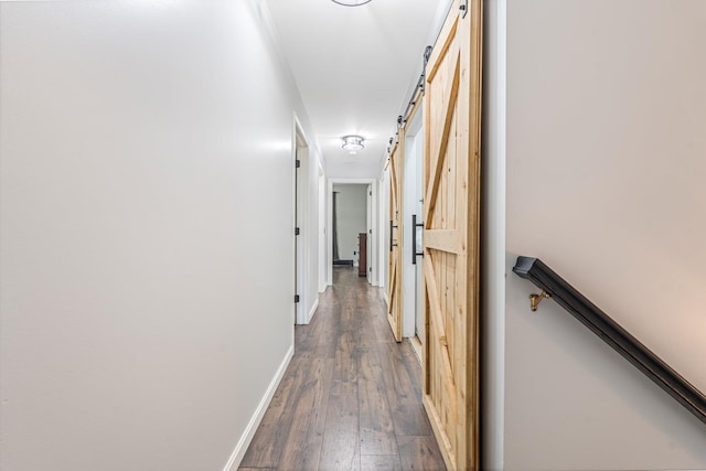 49 Balsam Dr, Waldoboro, ME 04572 - corridor featuring a barn door and hardwood / wood-style floors
