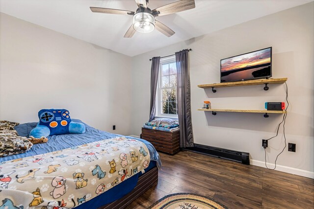 49 Balsam Dr, Waldoboro, ME 04572 - bedroom featuring ceiling fan, dark wood-type flooring, and a baseboard radiator