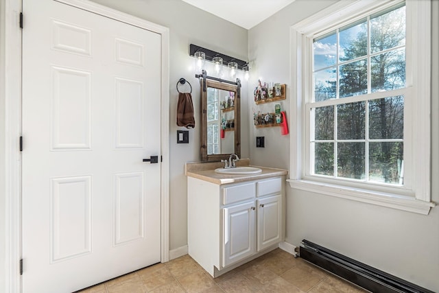 49 Balsam Dr, Waldoboro, ME 04572 - bathroom featuring baseboard heating, tile patterned floors, and vanity