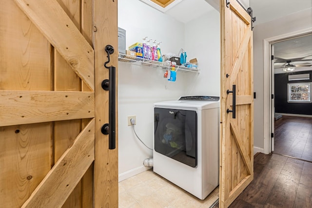 49 Balsam Dr, Waldoboro, ME 04572 - washroom with hardwood / wood-style floors, ceiling fan, a barn door, and washer / dryer