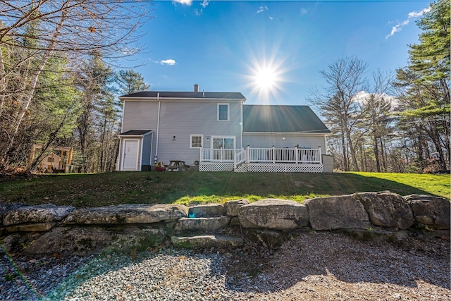 49 Balsam Dr, Waldoboro, ME 04572 - back of property with a deck and a yard