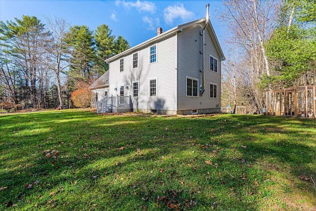 49 Balsam Dr, Waldoboro, ME 04572 - back of property with a lawn and a wooden deck