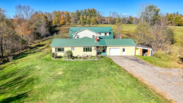 view of front of house with a front lawn and a garage