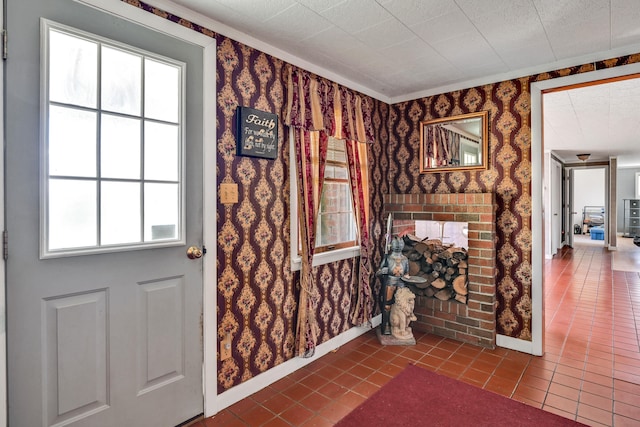 entryway featuring a fireplace and tile patterned floors