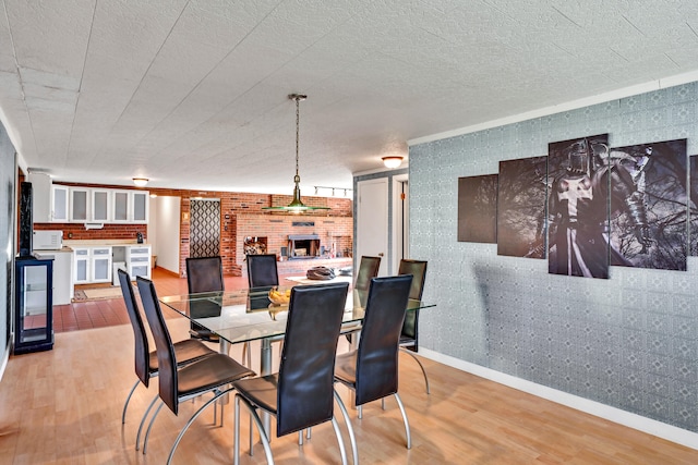 dining area with wine cooler and light hardwood / wood-style floors