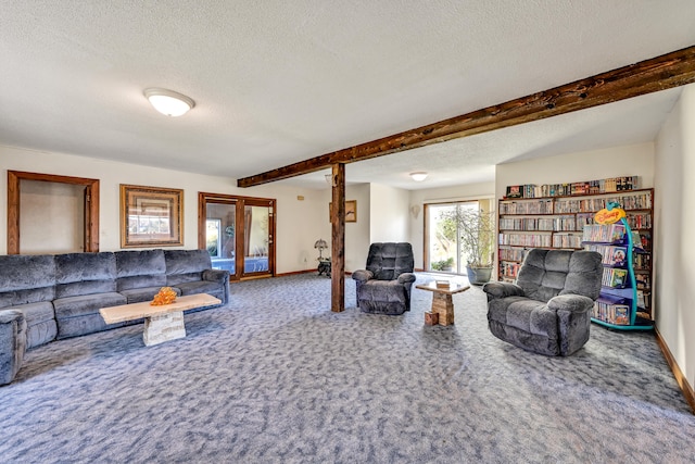 living room featuring carpet floors, beam ceiling, and a textured ceiling