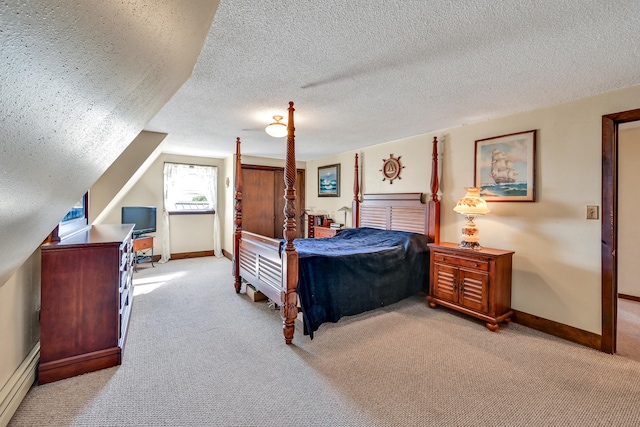 carpeted bedroom with a textured ceiling and a baseboard radiator