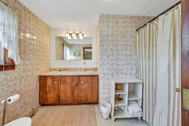 bathroom featuring tile patterned floors, vanity, toilet, and tile walls