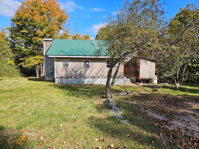 view of home's exterior with a lawn