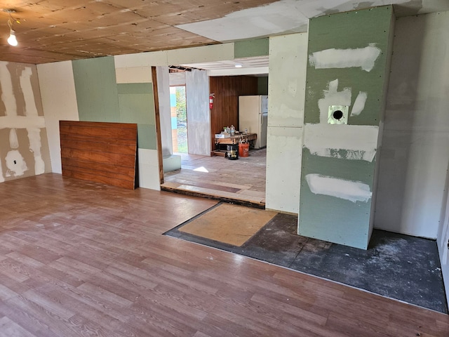 empty room with hardwood / wood-style flooring