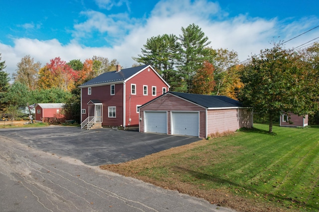 garage with a yard